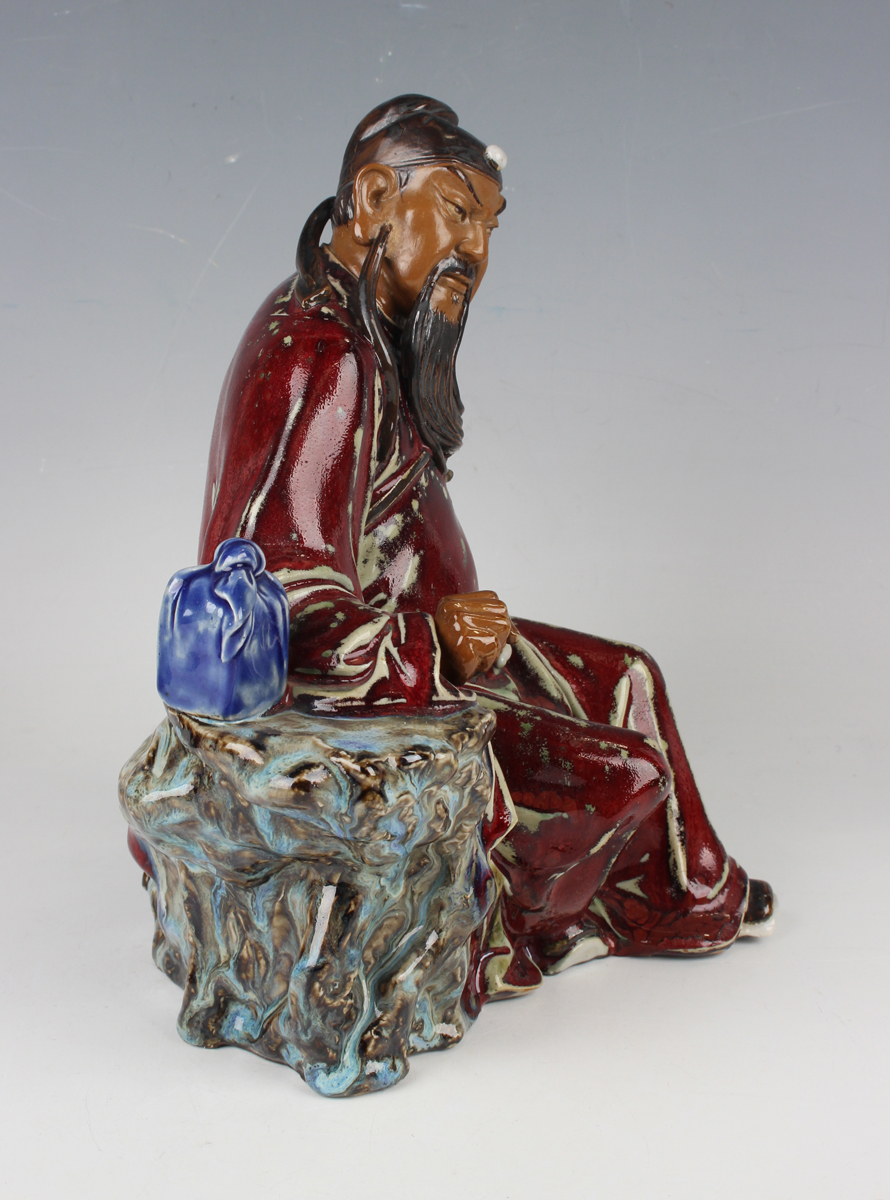 A Chinese Shiwan pottery sang-de-boeuf glazed figure of Guan Yu, modelled in a seated pose, - Image 20 of 22
