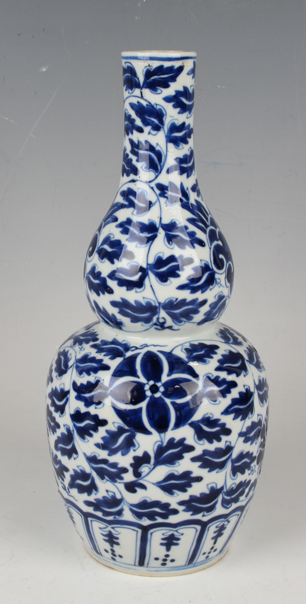A small group of Chinese blue and white porcelain, late 19th century, comprising a prunus- - Image 15 of 26