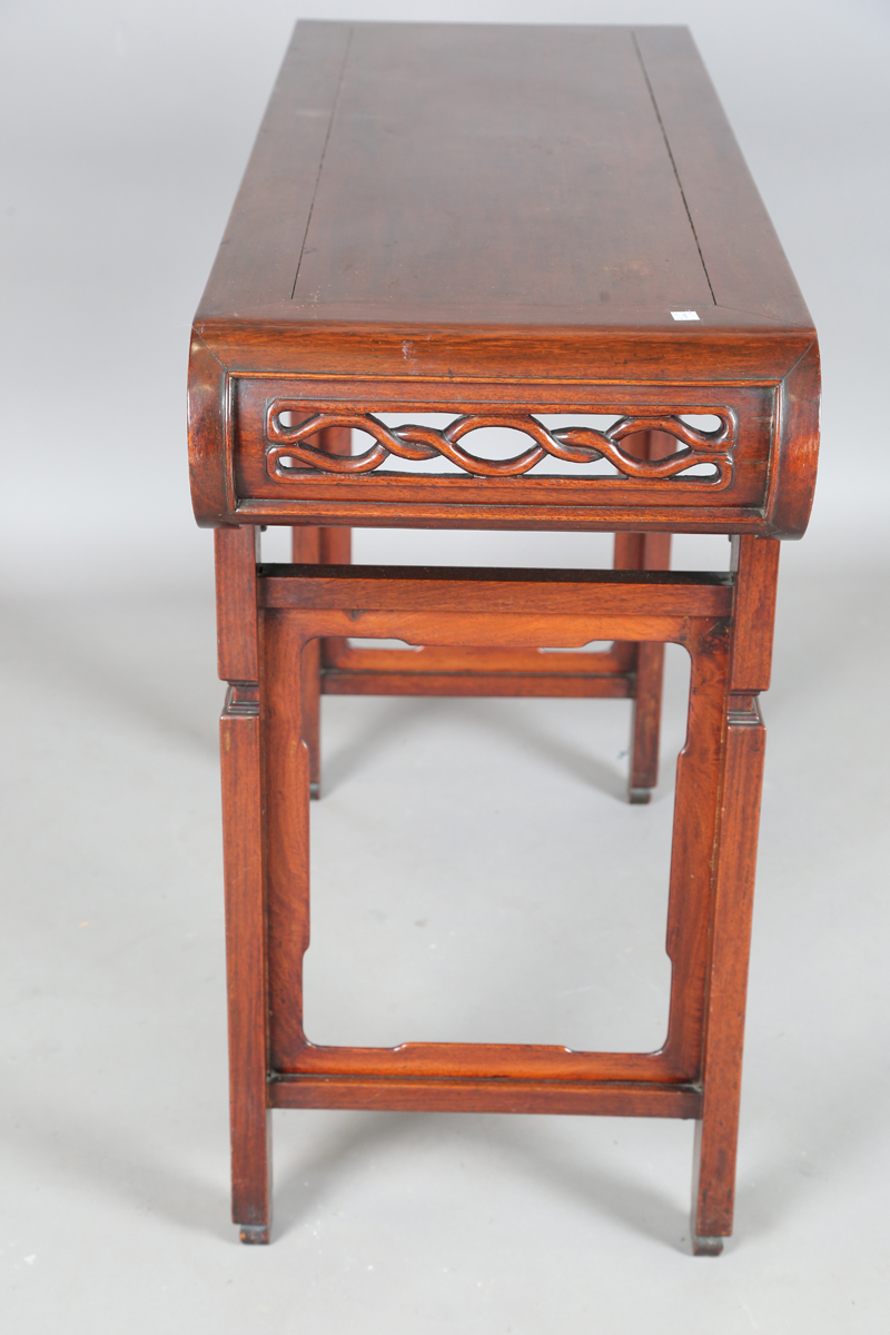 A Chinese hardwood altar table, 20th century, the rectangular panelled top with curved ends, the - Image 13 of 28