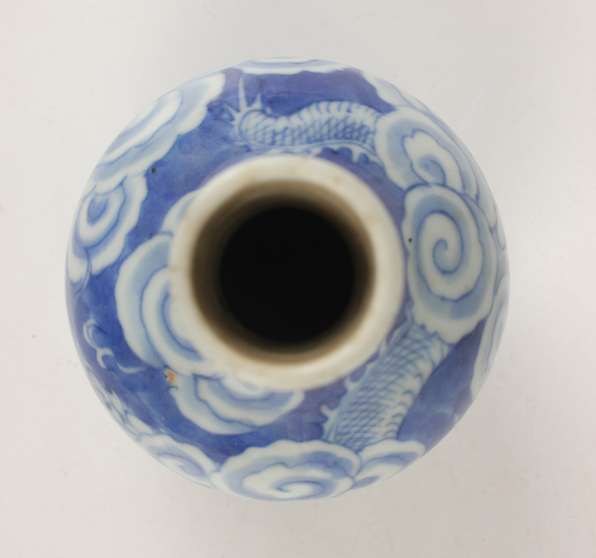 A Chinese blue and white porcelain bottle vase, Qing dynasty, painted with a dragon emerging through - Image 12 of 16