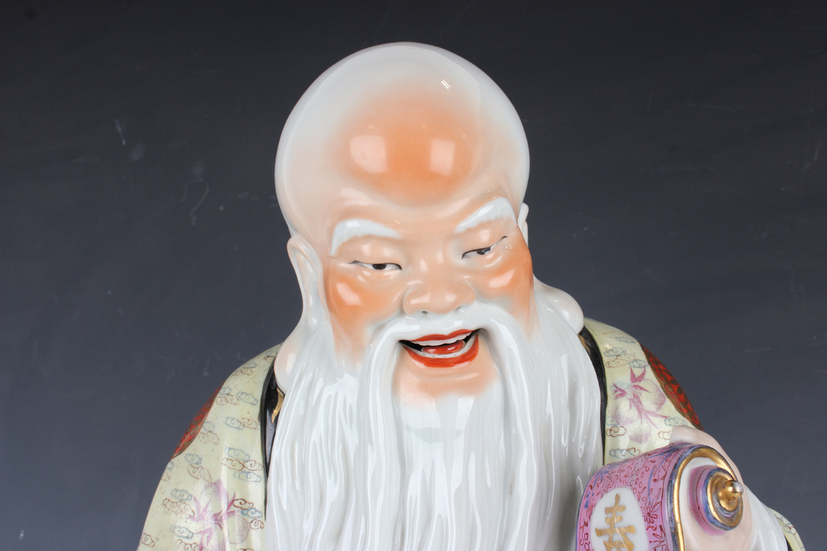 A Chinese famille rose porcelain figure of Shoulao, 20th century, modelled standing wearing a - Image 9 of 9