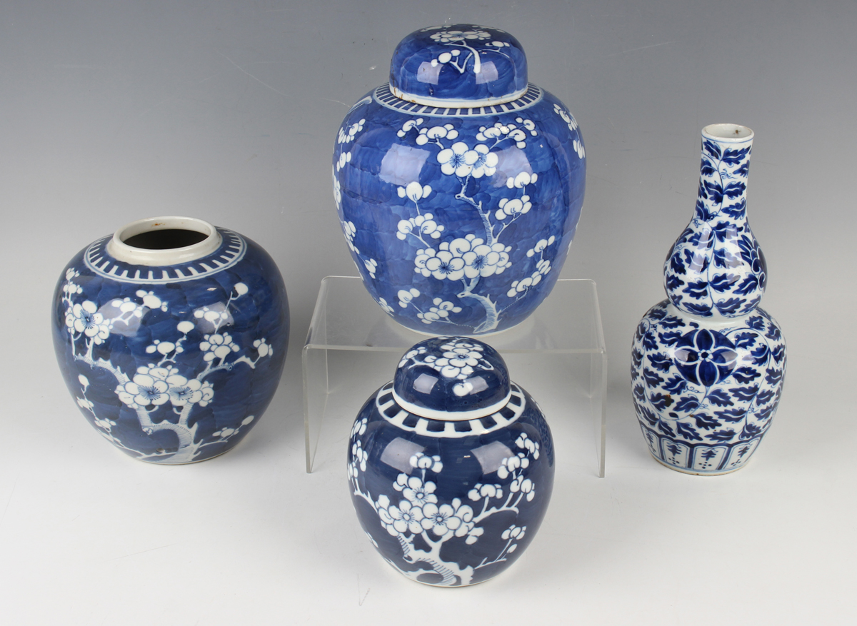 A small group of Chinese blue and white porcelain, late 19th century, comprising a prunus-