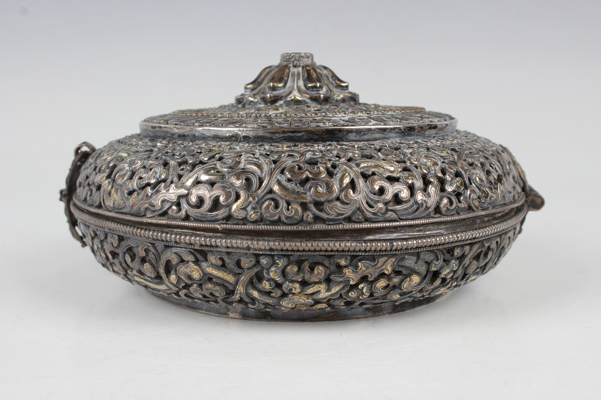 A South-east Asian white metal and parcel gilt circular box and cover, probably Tibetan or Chinese - Image 6 of 8
