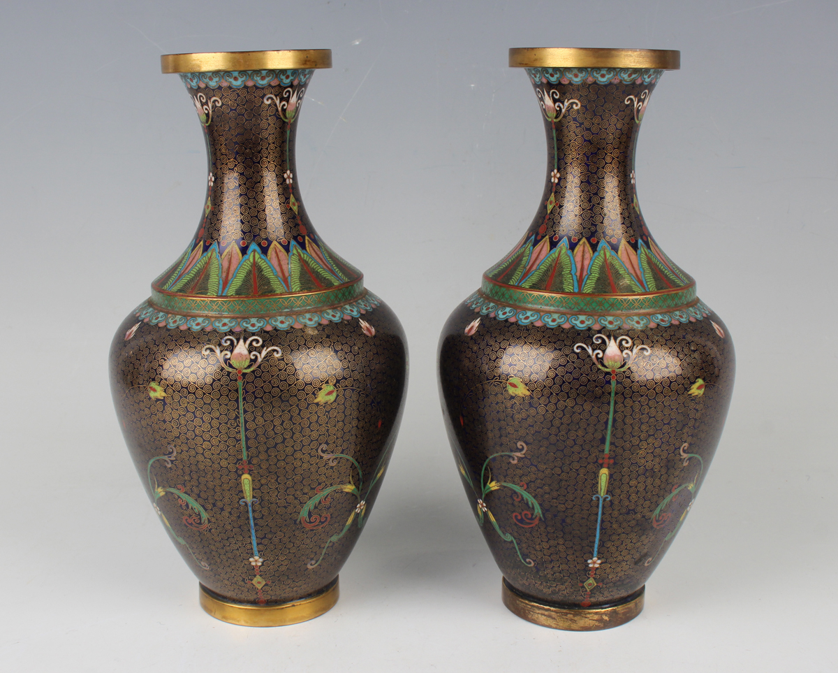 A pair of Chinese cloisonné bottle vases, early 20th century, each ovoid body and flared narrow neck