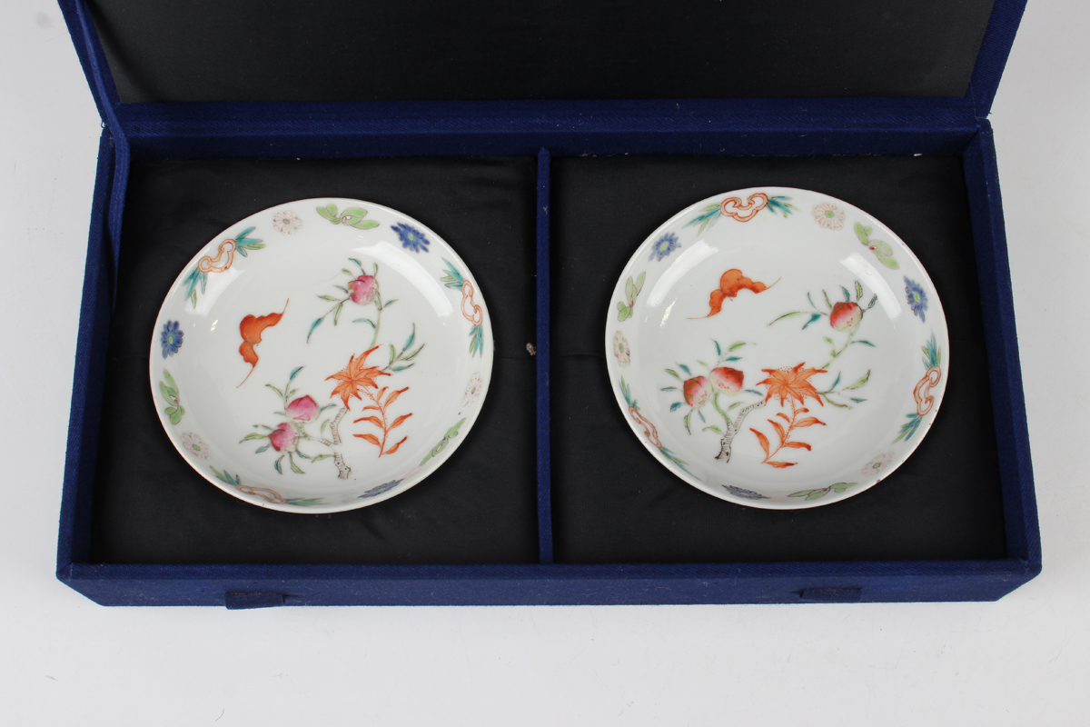 A pair of Chinese famille rose porcelain saucer dishes, 20th century, each painted with a bat and - Image 2 of 9
