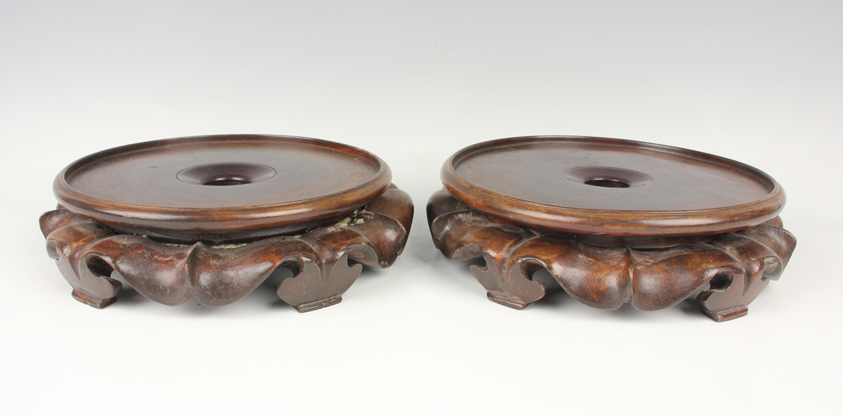 A collection of fourteen Chinese hardwood stands, 20th century, diameters ranging from 7.5cm to - Image 15 of 19