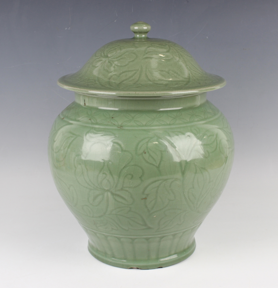 A Chinese carved celadon glazed jar and domed cover, Ming style but modern, carved in low relief - Image 10 of 11