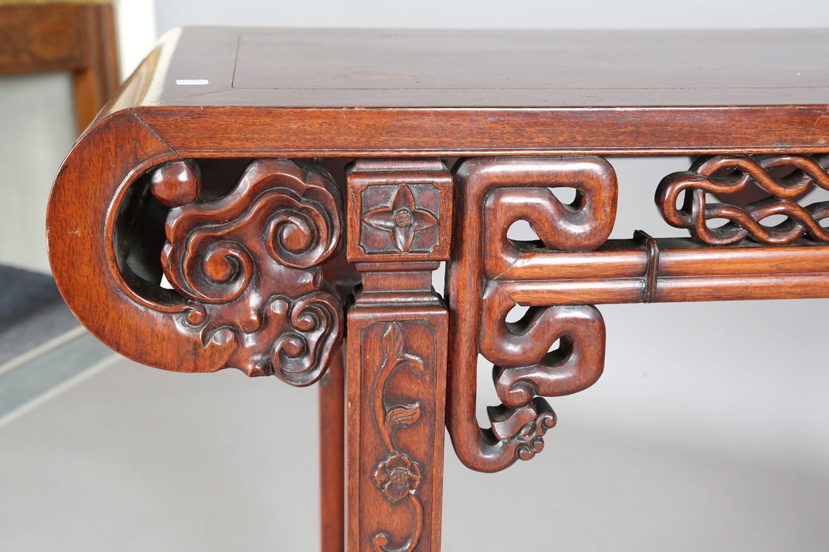 A Chinese hardwood altar table, 20th century, the rectangular panelled top with curved ends, the - Image 16 of 28