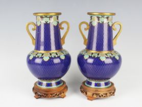 A pair of Chinese cloisonné vases, 20th century, each bulbous body and tapered neck decorated with a