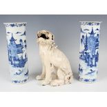 A pair of Chinese blue and white porcelain cylinder vases, mark of Kangxi but late 19th century,