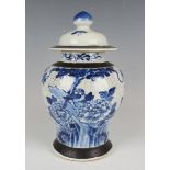 A Chinese blue and white crackle glazed porcelain jar and cover, late 19th/early 20th century, the