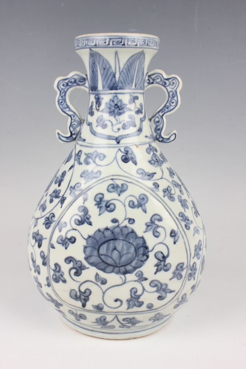 A Chinese Ming-style blue and white porcelain vase, the pear-form body painted with lotus and