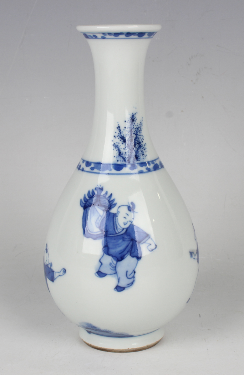 A Chinese blue and white porcelain bottle vase, Kangxi period, the ovoid body and flared narrow neck