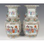 A pair of Chinese Canton famille rose porcelain vases, mid-19th century, each shouldered body and