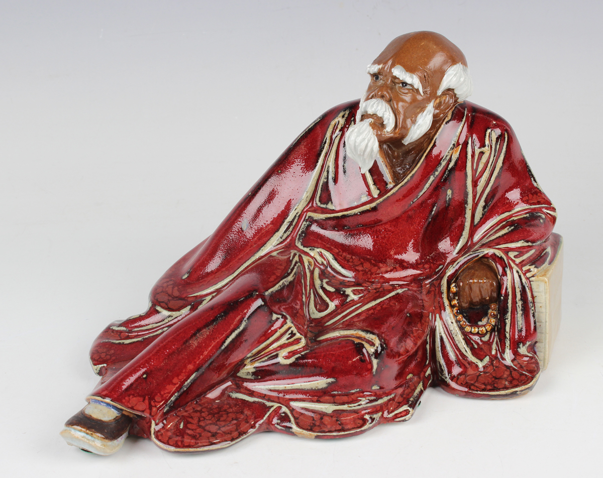 A Chinese Shiwan pottery sang-de-boeuf glazed figure of Guan Yu, modelled in a seated pose, - Image 14 of 22