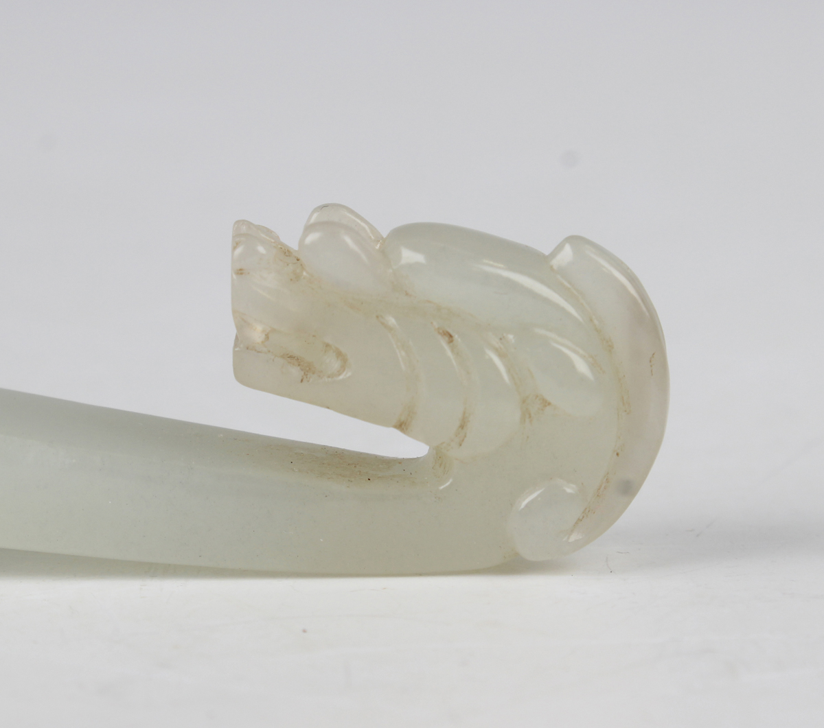 A Chinese pale celadon jade belthook and buckle, probably 20th century, the belthook of typical - Image 5 of 12