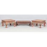 A pair of Chinese provincial hardwood square low tables, 20th century, each with carved floral