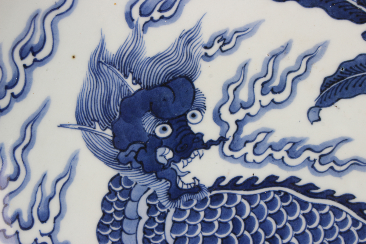 A Chinese blue and white porcelain circular dish, late Qing dynasty, painted with a seated kylin, - Image 7 of 7