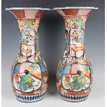 A pair of Japanese Imari porcelain vases by Hichozan Shinpo, Meiji period, each ovoid body and