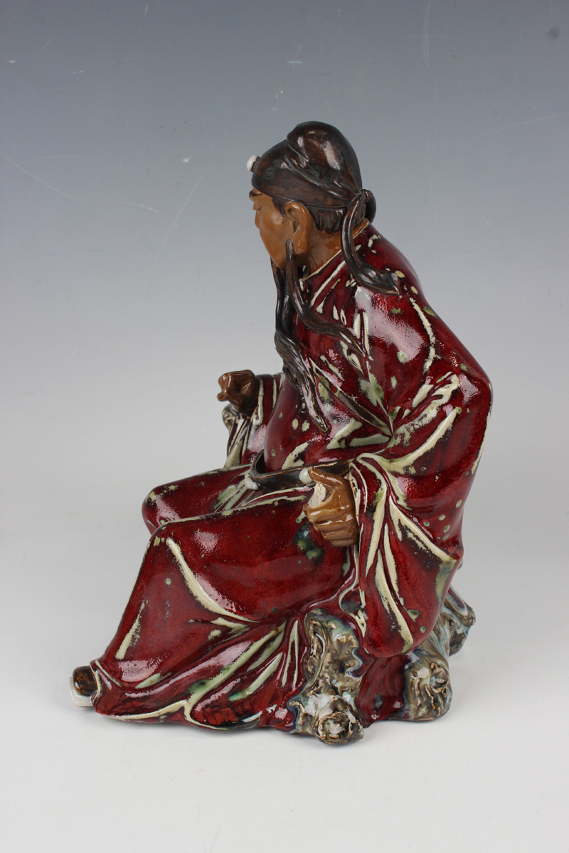 A Chinese Shiwan pottery sang-de-boeuf glazed figure of Guan Yu, modelled in a seated pose, - Image 18 of 22