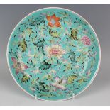 A Chinese famille rose turquoise ground porcelain saucer dish, mark of Qianlong but later Qing