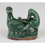 A Chinese green glazed pottery water dropper, Ming dynasty, modelled as a pair of ducks, height 7.