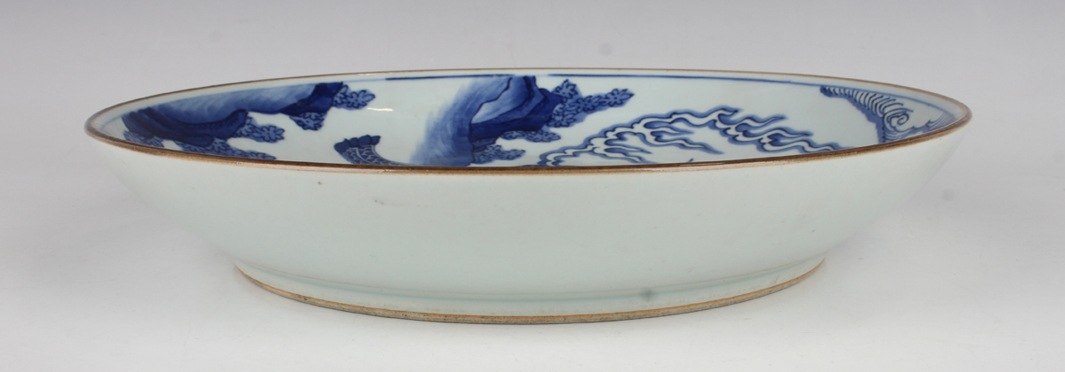 A Chinese blue and white porcelain circular dish, late Qing dynasty, painted with a seated kylin, - Image 2 of 7