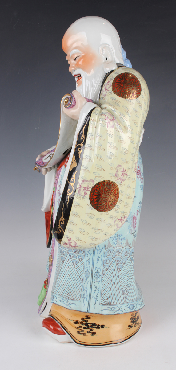 A Chinese famille rose porcelain figure of Shoulao, 20th century, modelled standing wearing a - Image 6 of 9