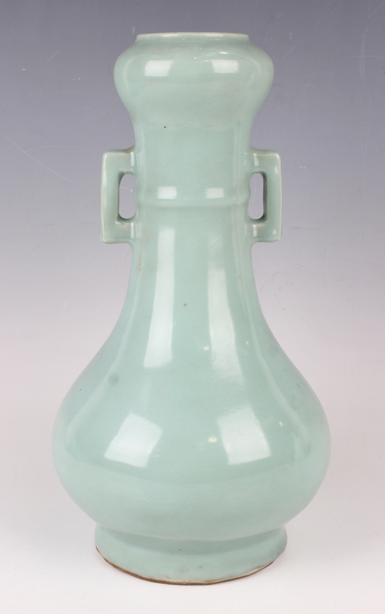 A Chinese celadon glazed porcelain bottle vase, probably late Qing dynasty, the pear form body