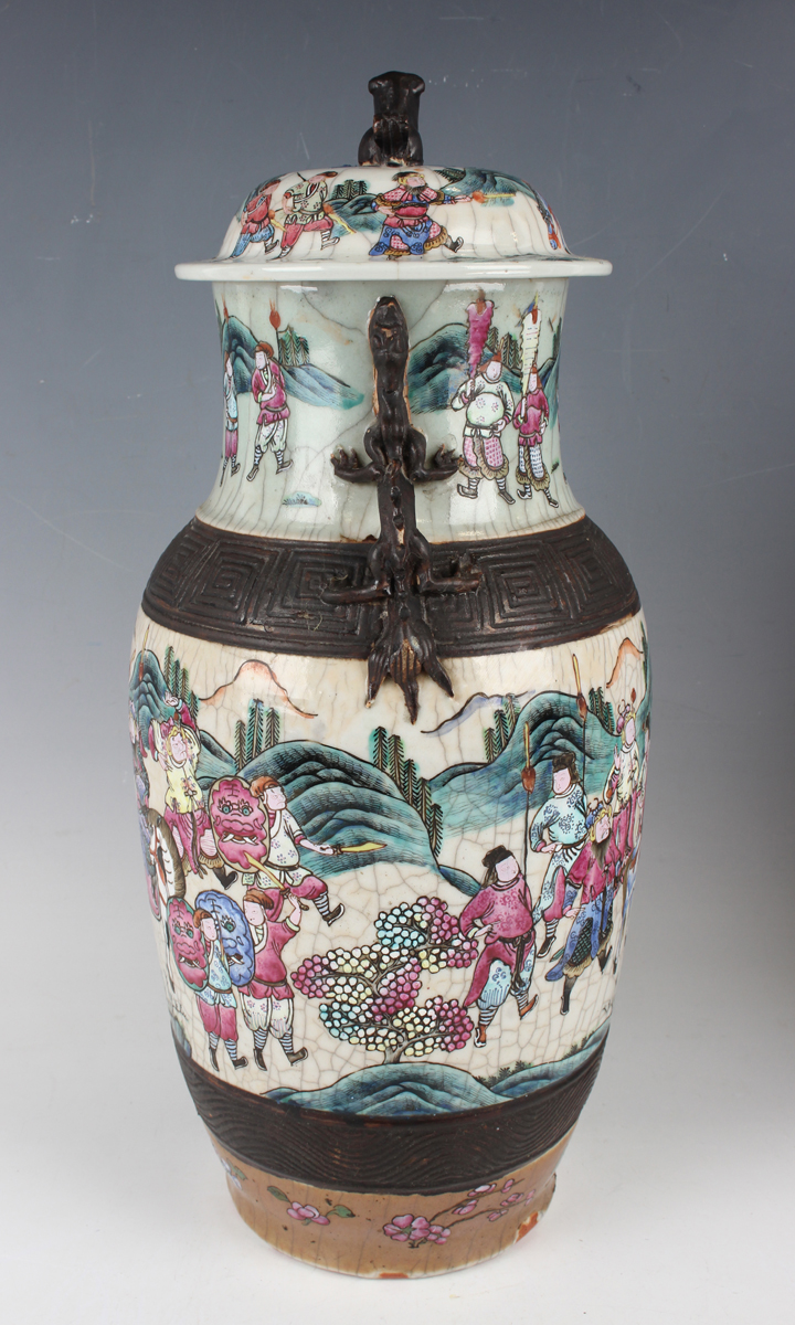 A pair of Chinese famille rose crackle glazed porcelain vases and covers, late 19th century, each - Image 25 of 26