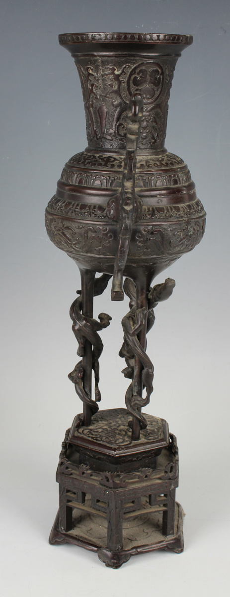 A pair of Japanese brown patinated bronze two-handled vases and integral stands, Meiji period, - Image 6 of 17