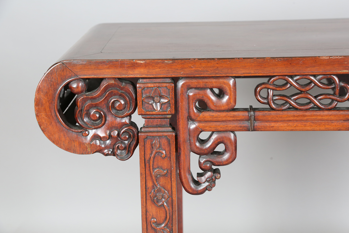 A Chinese hardwood altar table, 20th century, the rectangular panelled top with curved ends, the - Image 8 of 28