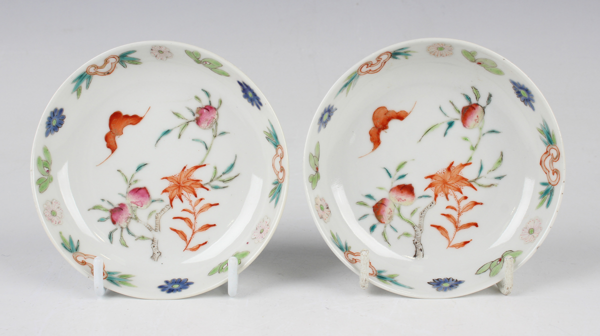 A pair of Chinese famille rose porcelain saucer dishes, 20th century, each painted with a bat and
