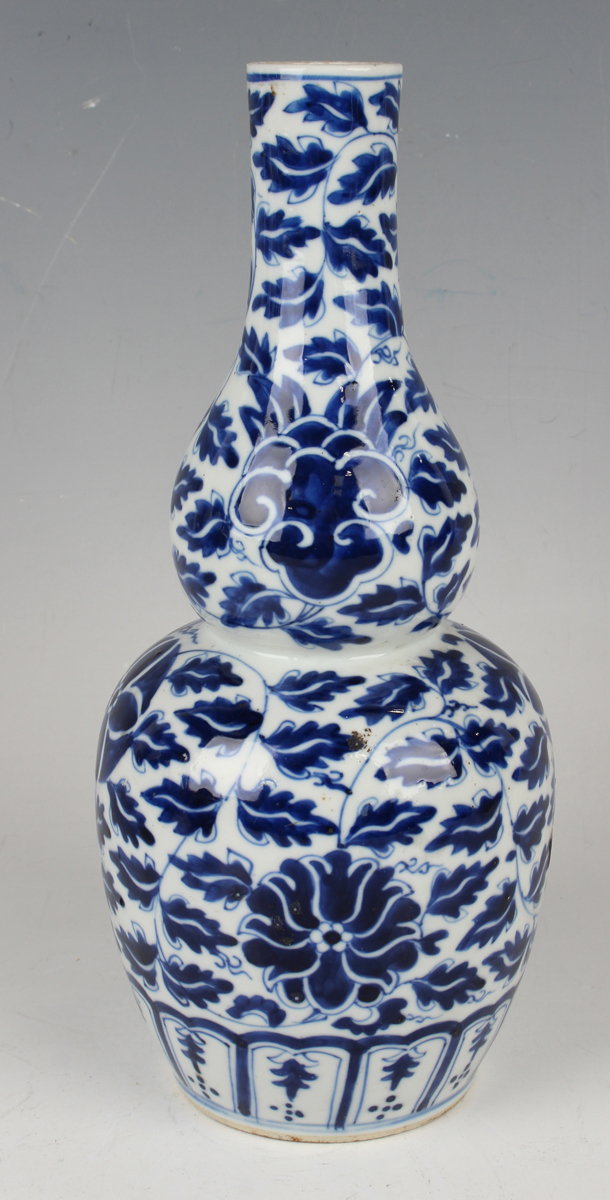 A small group of Chinese blue and white porcelain, late 19th century, comprising a prunus- - Image 14 of 26