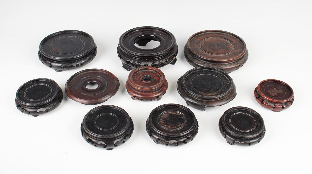 A collection of fourteen Chinese hardwood stands, 20th century, diameters ranging from 7.5cm to - Image 13 of 19