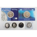 A small group of Elizabeth II silver crown-size coins, including a two-ounce silver Lion of