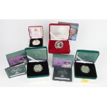 A small collection of Elizabeth II commemorative silver coins, including two piedfort issue