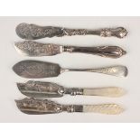 A Victorian silver Old English pattern butter knives, engraved with fern fronds, Birmingham 1876