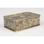 A George III silver gilt rectangular snuff box, the hinged lid finely cast with a border of fruiting