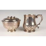 A George V silver tankard with scroll handle, the baluster body decorated with cut-card foliate