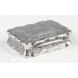 A Victorian silver shaped rectangular vinaigrette, engraved with leaves and scrolls, the hinged