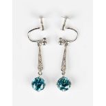 A pair of Art Deco white gold, diamond and blue zircon pendant earrings with screw fittings,