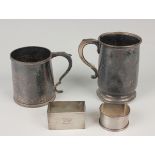 An Edwardian silver tapering cylindrical christening tankard with scroll handle and reeded rims,