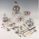 A small group of silver items, including a toast rack, Birmingham 1931, napkin ring, decanter