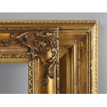 A 19th century gilt composition frame of wide section, rebate 48cm x 63m, together with a carved and