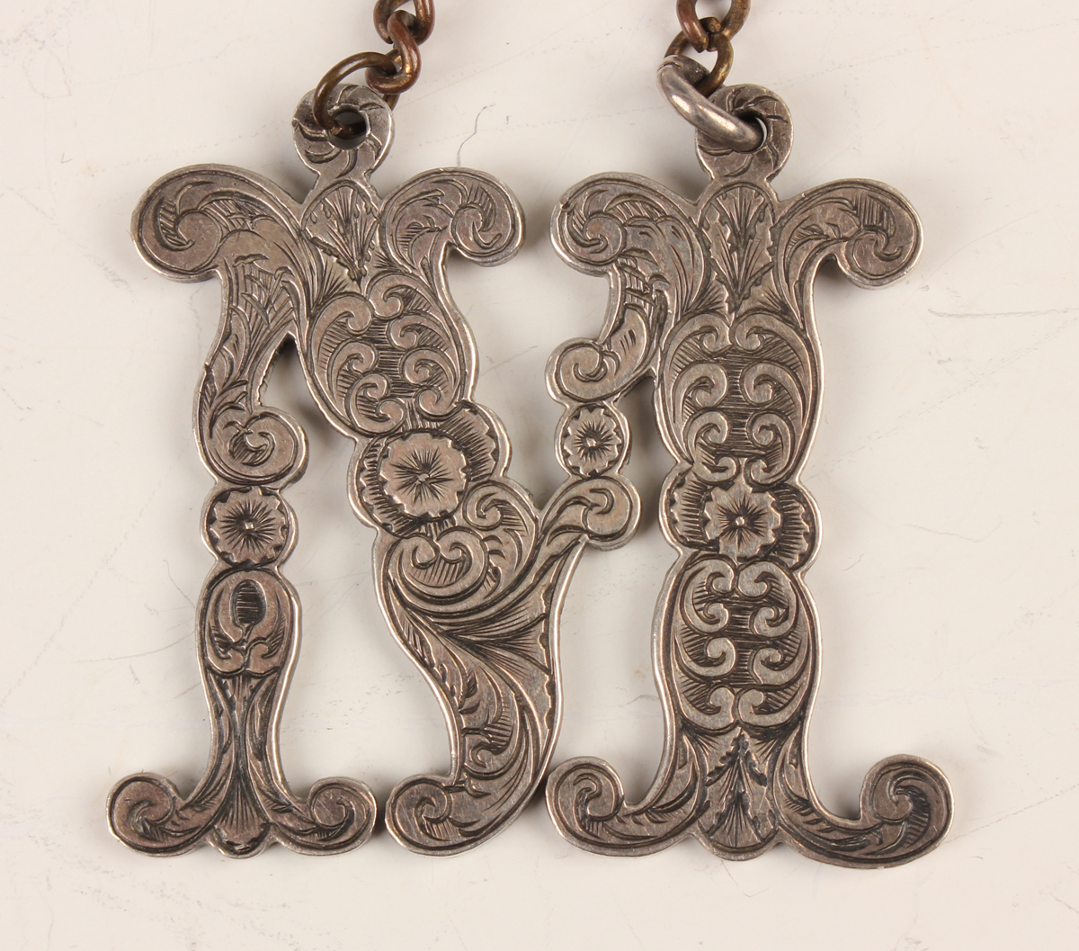 A William IV silver decanter label in the form of a vine leaf pierced with 'Madeira', London 1836, - Image 3 of 4