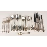 An Elizabeth II part canteen of silver Hanoverian feather edge cutlery, comprising four tablespoons,