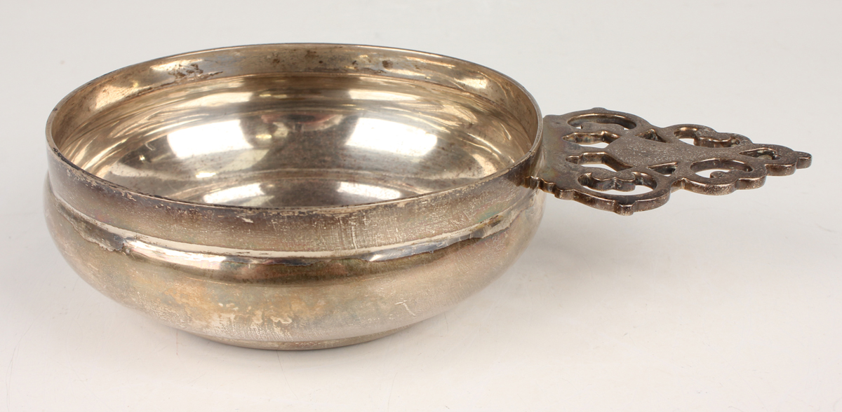 A George V silver circular bowl, the tab handle with pierced decoration, London 1934 by Jones & Son, - Image 4 of 4