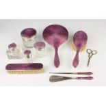 A George V silver and purple enamelled matched vanity set, comprising hand mirror, hairbrush and
