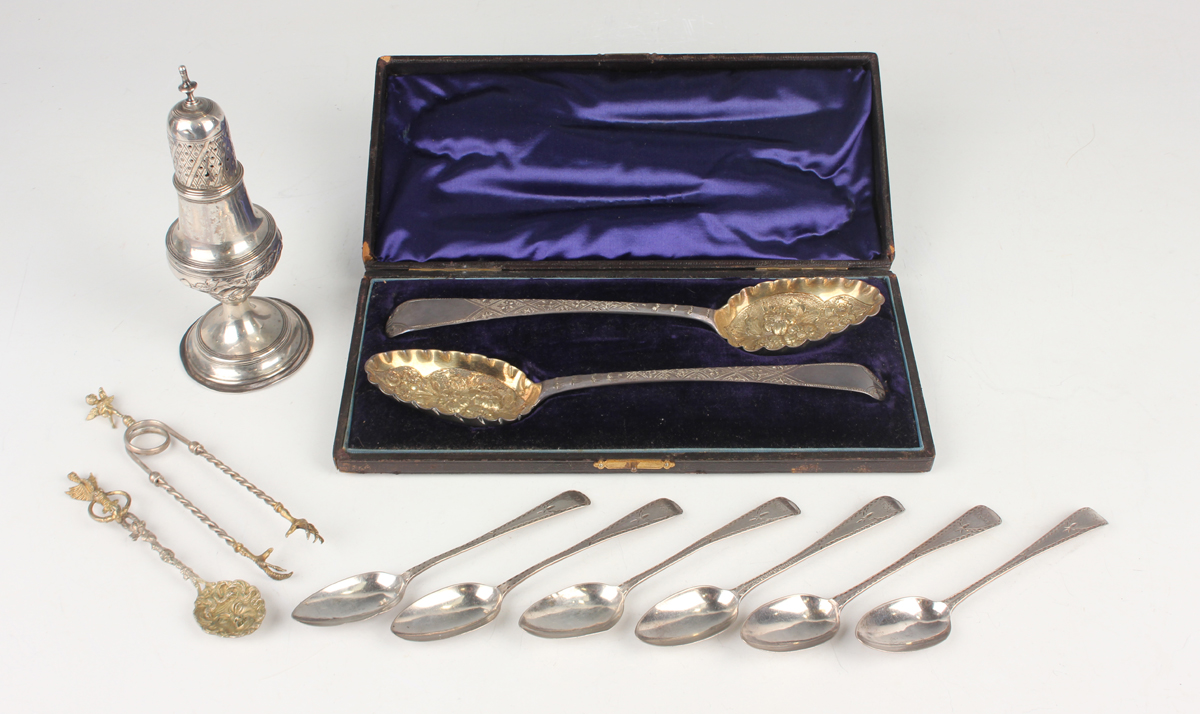 A pair of George III silver Old English pattern serving spoons, later embossed and engraved with